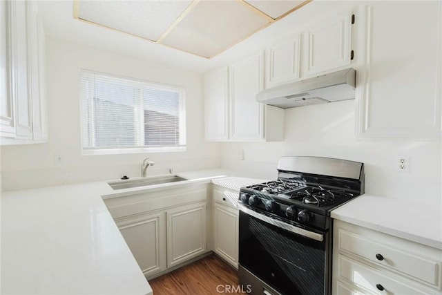 28023 Robin Ave, Saugus, CA 91350 - kitchen featuring stainless steel gas range oven, under cabinet range hood, light countertops, and white cabinets