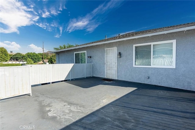 28023 Robin Ave, Saugus, CA 91350 - rear view of property featuring a wooden deck, stucco siding, and a patio