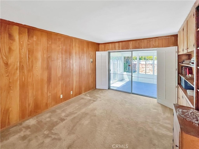 11753 Kling St, Valley Village, CA 91607 - empty room with wooden walls and light carpet
