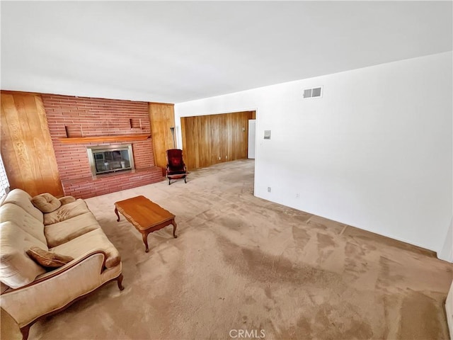 11753 Kling St, Valley Village, CA 91607 - living room with light colored carpet, a fireplace, and wooden walls