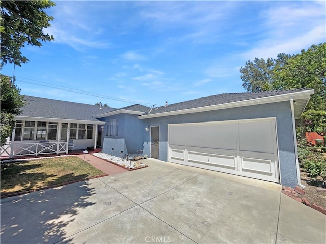 11753 Kling St, Valley Village, CA 91607 - view of front facade featuring driveway, a garage, and stucco siding