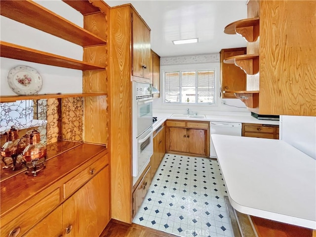 11753 Kling St, Valley Village, CA 91607 - kitchen with open shelves, white appliances, light countertops, light flooring, and brown cabinetry