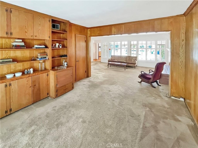 11753 Kling St, Valley Village, CA 91607 - sitting room featuring light colored carpet, wood walls, and ornamental molding