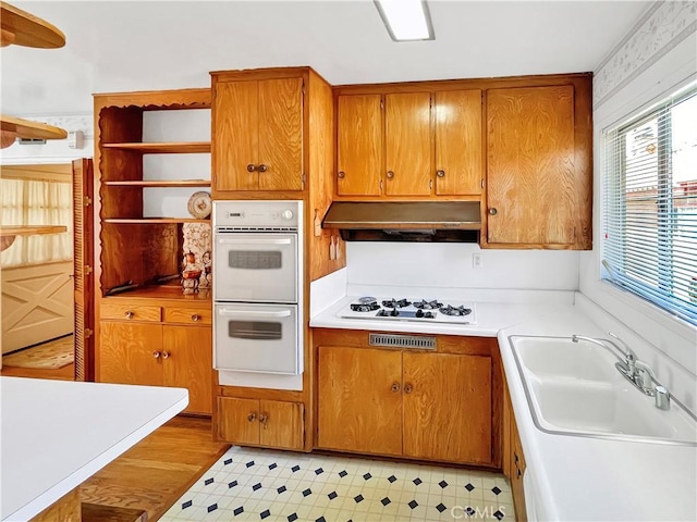 11753 Kling St, Valley Village, CA 91607 - kitchen with white appliances, plenty of natural light, brown cabinets, and open shelves