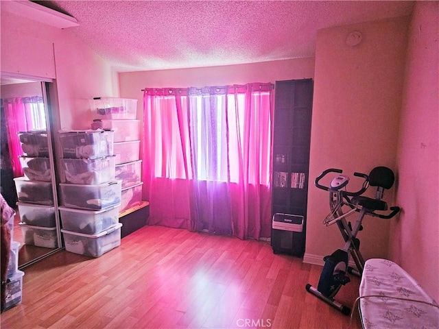 675 N Lark Ellen Ave, Covina, CA 91722 - spare room featuring healthy amount of natural light, wood finished floors, a textured ceiling, and a smoke detector