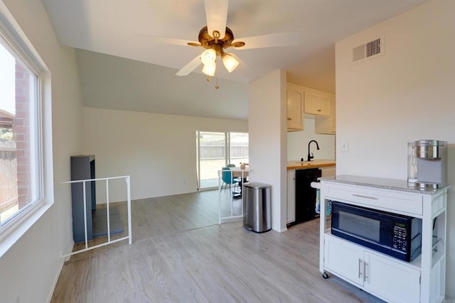 1547 Cochabamba St, San Diego, CA 92154 - kitchen featuring black appliances, vaulted ceiling, light wood-style flooring, light countertops, and a ceiling fan