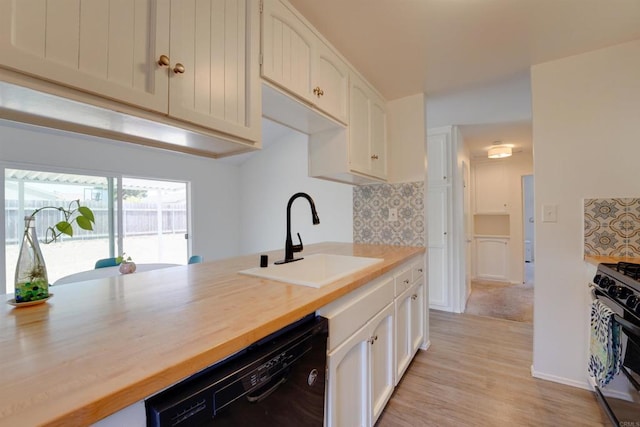 1547 Cochabamba St, San Diego, CA 92154 - kitchen with black dishwasher, range with gas cooktop, tasteful backsplash, and white cabinets