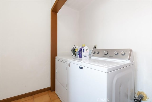 65380 San Lucas Rd, Lockwood, CA 93932 - washroom with washer and clothes dryer and light tile patterned floors