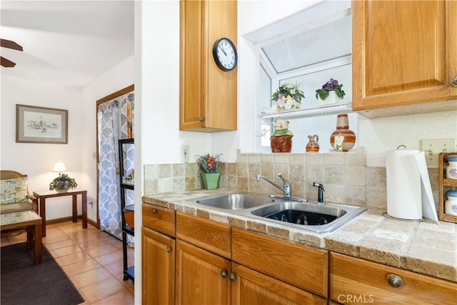 65380 San Lucas Rd, Lockwood, CA 93932 - kitchen with tile counters, a ceiling fan, light tile patterned floors, and decorative backsplash
