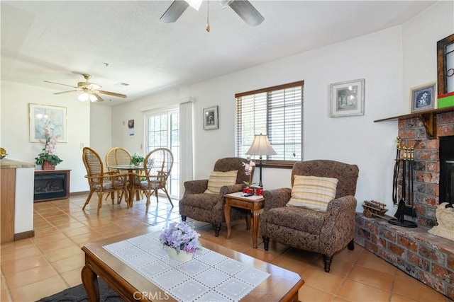 65380 San Lucas Rd, Lockwood, CA 93932 - living area with a ceiling fan, light tile patterned floors, and a fireplace