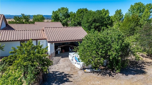 65380 San Lucas Rd, Lockwood, CA 93932 - rear view of house with a tiled roof and stucco siding