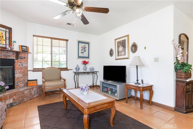 65380 San Lucas Rd, Lockwood, CA 93932 - living room featuring light tile patterned flooring, a fireplace, and ceiling fan