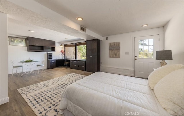 1653 W Cypress Ave, Redlands, CA 92373 - bedroom with wood finished floors, a textured ceiling, and recessed lighting