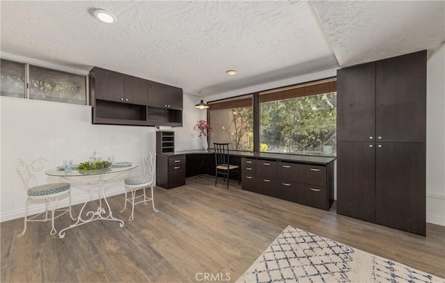 1653 W Cypress Ave, Redlands, CA 92373 - kitchen with a textured ceiling, wood finished floors, dark brown cabinetry, open shelves, and recessed lighting