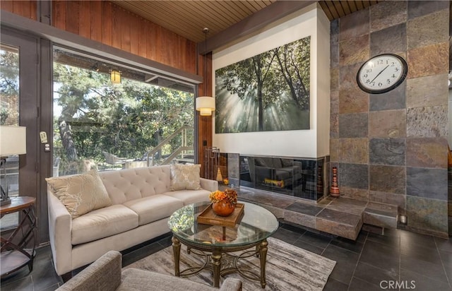 1653 W Cypress Ave, Redlands, CA 92373 - living area featuring plenty of natural light, wooden ceiling, a tile fireplace, and wooden walls