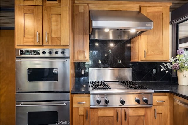 1653 W Cypress Ave, Redlands, CA 92373 - kitchen featuring stainless steel appliances, range hood, backsplash, and brown cabinetry
