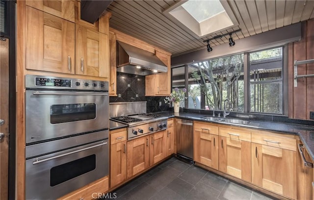 1653 W Cypress Ave, Redlands, CA 92373 - kitchen featuring wall chimney range hood, stainless steel appliances, a skylight, decorative backsplash, and wood ceiling