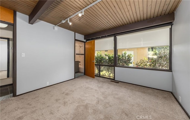 1653 W Cypress Ave, Redlands, CA 92373 - empty room with rail lighting, carpet, and a wood ceiling with exposed beams