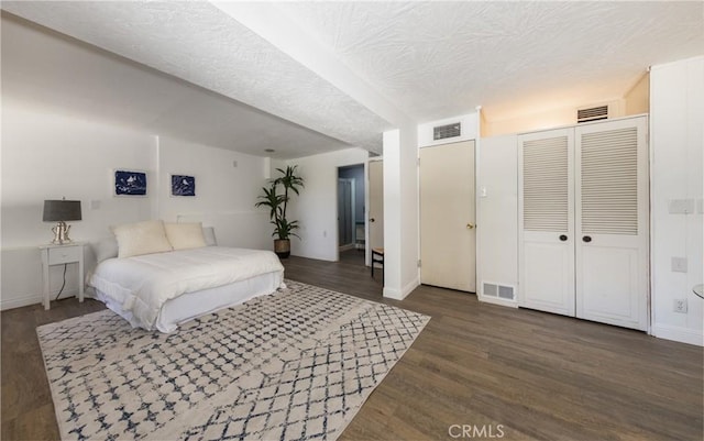 1653 W Cypress Ave, Redlands, CA 92373 - bedroom featuring wood finished floors, a textured ceiling, and a closet