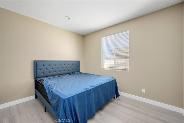 27741 Solitude Ave, Moreno Valley, CA 92555 - bedroom featuring wood finished floors and baseboards