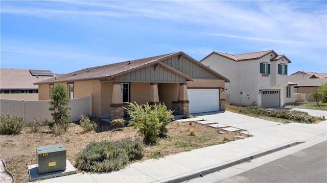 27741 Solitude Ave, Moreno Valley, CA 92555 - view of front of house featuring stucco siding, driveway, stone siding, and a garage