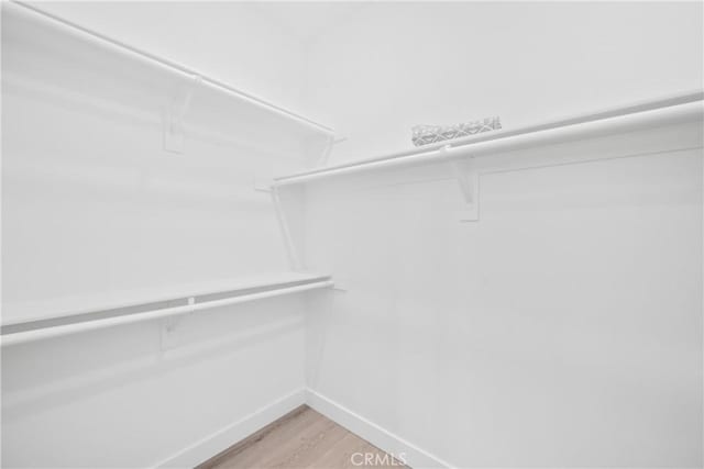27741 Solitude Ave, Moreno Valley, CA 92555 - walk in closet with light wood-type flooring
