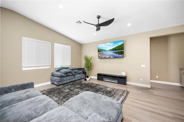 27741 Solitude Ave, Moreno Valley, CA 92555 - living area featuring a ceiling fan, wood finished floors, vaulted ceiling, and recessed lighting