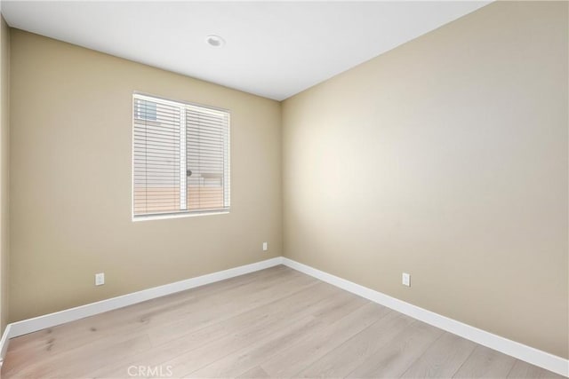 27741 Solitude Ave, Moreno Valley, CA 92555 - spare room featuring light wood-style flooring and baseboards