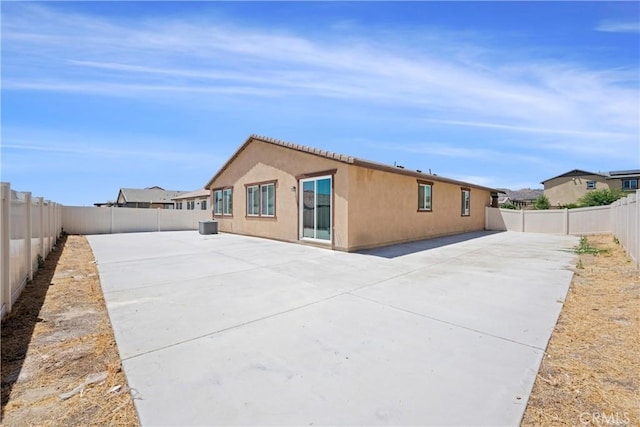 27741 Solitude Ave, Moreno Valley, CA 92555 - back of house featuring a fenced backyard, a patio, and stucco siding