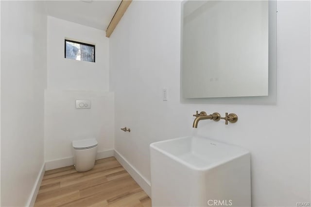 216 Leonard Ln, Big Bear, CA 92386 - half bathroom featuring toilet and wood finished floors