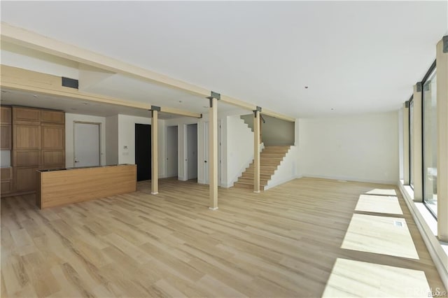 216 Leonard Ln, Big Bear, CA 92386 - unfurnished living room featuring stairs and light wood-type flooring