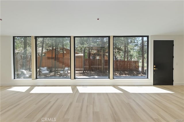216 Leonard Ln, Big Bear, CA 92386 - unfurnished living room featuring wood finished floors and baseboards