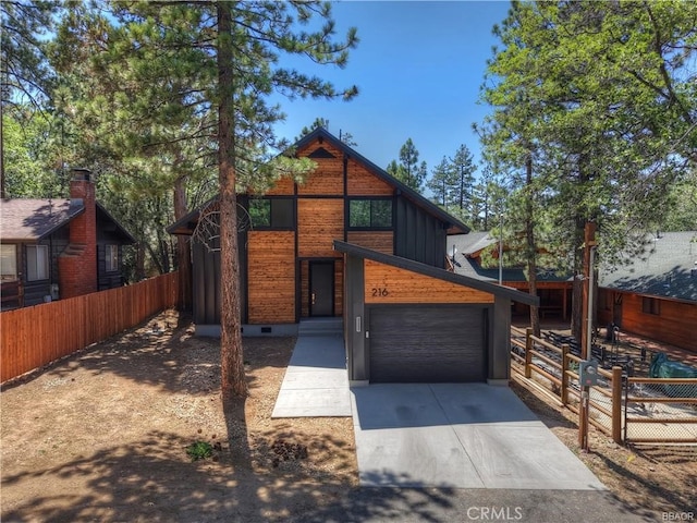 216 Leonard Ln, Big Bear, CA 92386 - contemporary home featuring concrete driveway and a garage