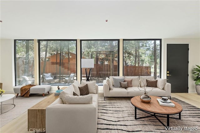 216 Leonard Ln, Big Bear, CA 92386 - living area featuring plenty of natural light, a wall of windows, and wood finished floors