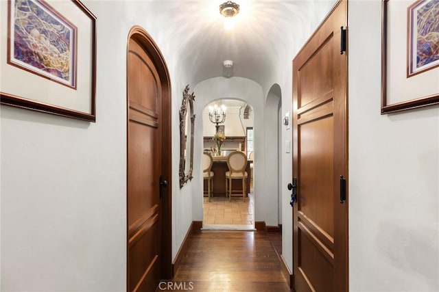 1811 N Flower St, Santa Ana, CA 92706 - hall with arched walkways and dark wood finished floors