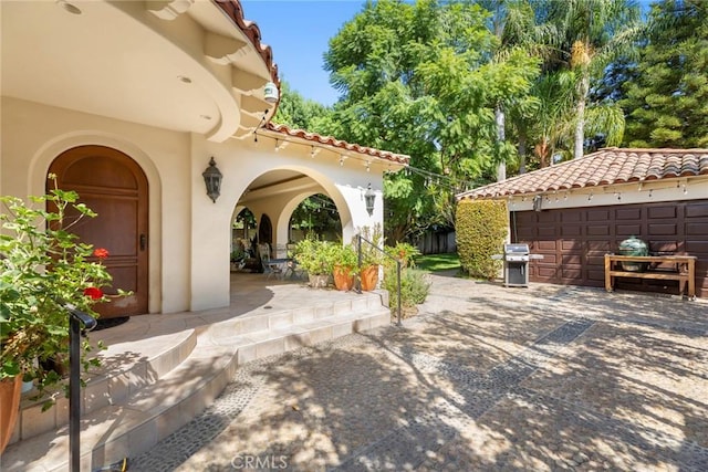 1811 N Flower St, Santa Ana, CA 92706 - view of patio featuring area for grilling and a detached garage