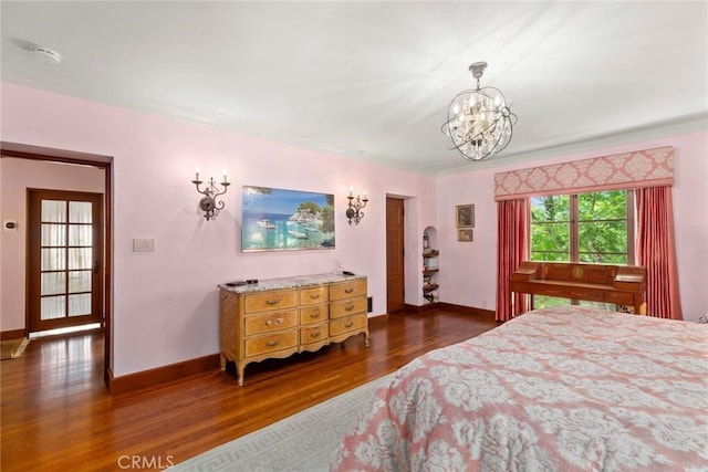 1811 N Flower St, Santa Ana, CA 92706 - bedroom featuring dark wood-type flooring, a chandelier, and ornamental molding