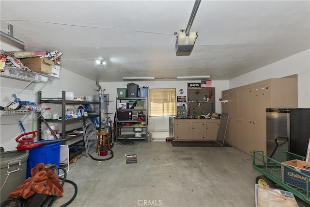 325 Brentwood, Lake Arrowhead, CA 92352 - garage featuring a garage door opener and secured water heater