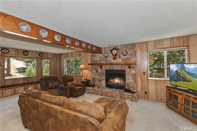325 Brentwood, Lake Arrowhead, CA 92352 - living area featuring carpet flooring, wood walls, a textured ceiling, and a fireplace