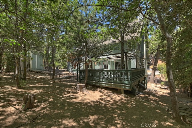 325 Brentwood, Lake Arrowhead, CA 92352 - rear view of property with a wooden deck and a shed