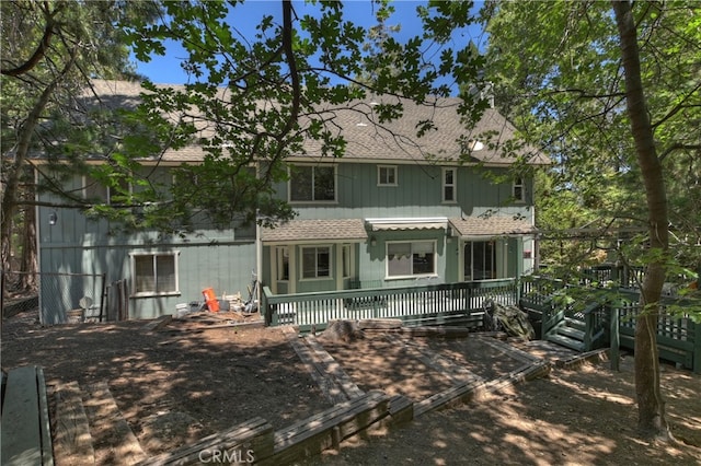 325 Brentwood, Lake Arrowhead, CA 92352 - back of house featuring a shingled roof and a deck