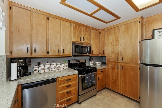 325 Brentwood, Lake Arrowhead, CA 92352 - kitchen with appliances with stainless steel finishes, light countertops, and decorative backsplash