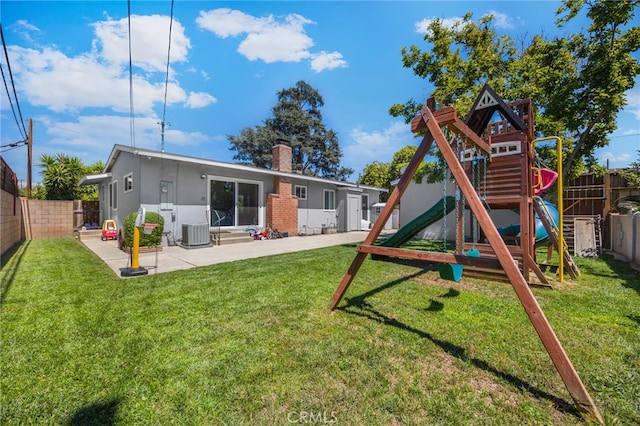 1051 Russell St, La Habra, CA 90631 - back of house featuring a playground, a fenced backyard, a chimney, and a patio area