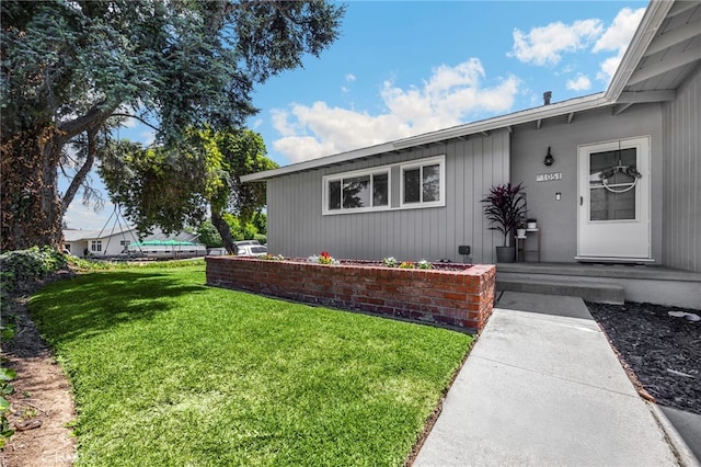 1051 Russell St, La Habra, CA 90631 - view of exterior entry with a lawn