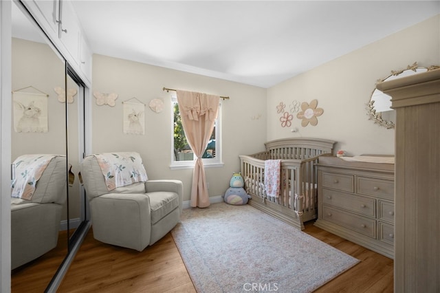 1051 Russell St, La Habra, CA 90631 - bedroom featuring a closet, wood finished floors, and a crib