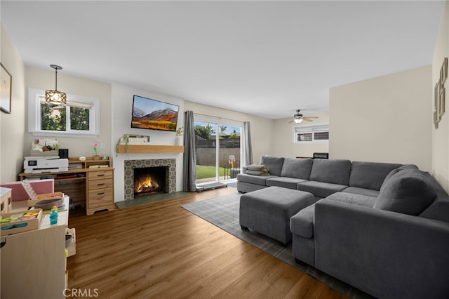 1051 Russell St, La Habra, CA 90631 - living area featuring wood finished floors, a fireplace with flush hearth, and a ceiling fan