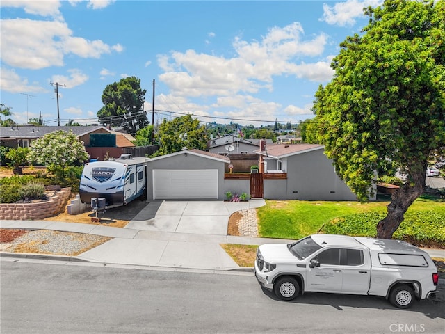 1051 Russell St, La Habra, CA 90631 - view of front of property with driveway, a garage, and a front lawn