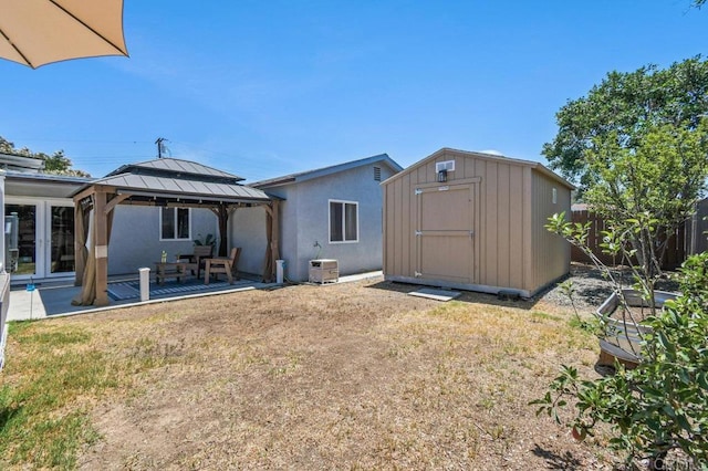 506 Broadview St, Spring Valley, CA 91977 - back of house featuring a gazebo, a storage shed, stucco siding, and a patio