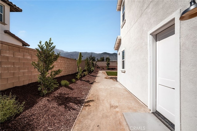 13428 Silver Sky Rd, Rancho Cucamonga, CA 91739 - view of yard with a mountain view and a patio area