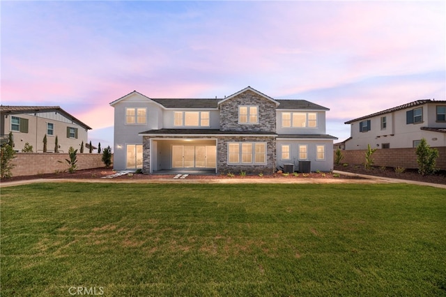 13428 Silver Sky Rd, Rancho Cucamonga, CA 91739 - traditional-style home featuring stucco siding, a lawn, and stone siding